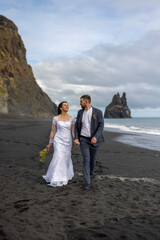 In a breathtaking wedding in Iceland, the couple walked hand in hand along Reynisfjara Black Sand Beach, creating timeless memories filled with joy and happiness to cherish forever