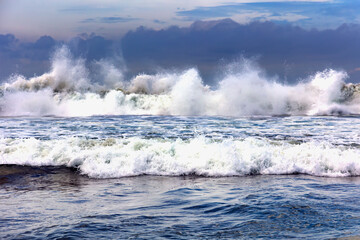Fototapeta premium Panorama of natural Indian Ocean with big foamy waves crashing on sandy shore. Sri Lanka. Asia 
