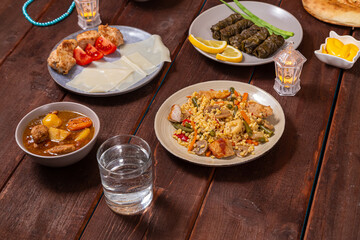 Set table for iftar in Ramadan, water, finii, dolma, khinkal and stewed lamb