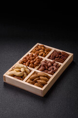 Wooden box with nuts cashew, hazelnut, almond, brazil, pecan, walnut