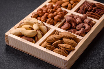 Wooden box with nuts cashew, hazelnut, almond, brazil, pecan, walnut