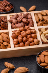 Wooden box with nuts cashew, hazelnut, almond, brazil, pecan, walnut