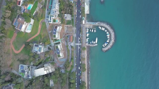 4K aerial landscape footage of the G pier in Barcola, Trieste, Italy. A breathtaking panoramic view of the Adriatic Gulf, rugged cliffs, and coastal nature. Ideal for travel and documentary content