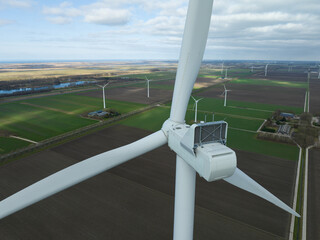 Wind turbines in the dutch country side, renewable energy, green clean wind power.