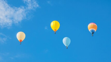 Fototapeta premium colorful balloons rise against bright blue sky evoking sense of joy and festivity