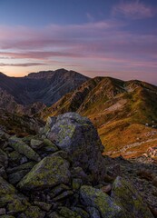 Obraz premium Sunrise from the ridge of the Western Tatras, Rohace (Roháče) overlooking the hill Salatin with a beautiful sky and grass lit by the rising sun. Tatry, Slovakia, Poland.