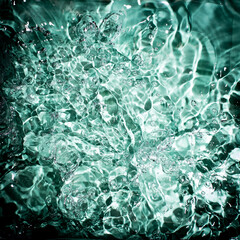 Abstract blue background of chaotic splashes of water 