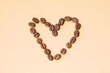 Coffee beans arranged in heart shape conveys love for coffee creativity