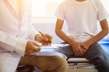A young man suffering from erectile dysfunction seeks consultation with a specialist to identify...