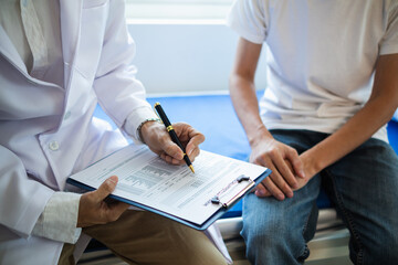 A young man suffering from erectile dysfunction seeks consultation with a specialist to identify...