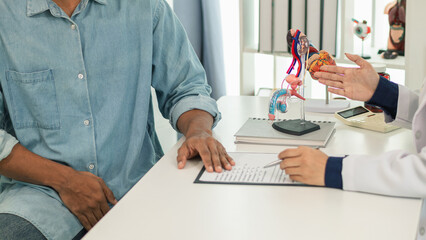 A young man suffering from erectile dysfunction seeks consultation with a specialist to identify...