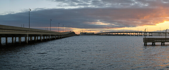 Barron Collier Bridge and Gilchrist Bridge in Florida with moving traffic. Transportation...
