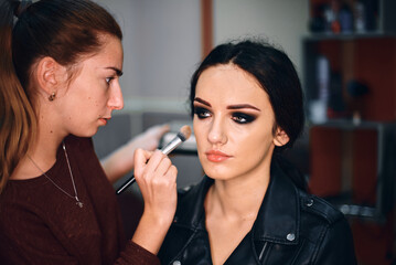 Professional Makeup Artist Creating a Bold Look