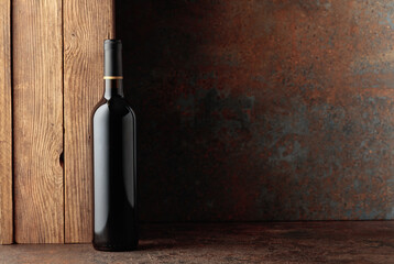 Bottle of red wine on a vintage background.