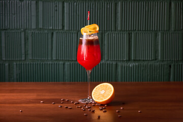 Vibrant Red Cocktail with Orange and Coffee Accents