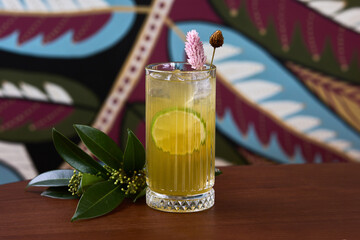 Tropical Citrus Cocktail with Floral Garnish
