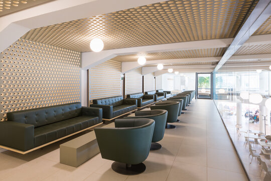 Modern lounge interior in club with elegant green seating arrangement