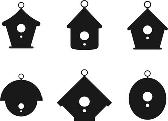 Set of silhouettes of birdhouses with hanging rings. Vector, transparent background