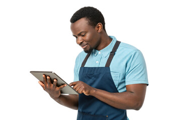 man in blue shirt and apron using tablet, showcasing food, technology, and engagement in his work