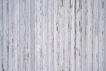 Aged white wooden boards with peeling paint