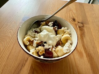 Cottage cheese bowl or curd cheese with banana, walnut and jam also called turkish lor peyniri
