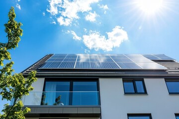 Fototapeta premium solar panels on the roof of a modern house in Germany, against a blue sky on a sunny day