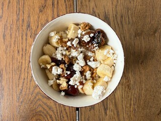 Cottage cheese bowl or curd cheese with banana, walnut and jam also called turkish lor peyniri