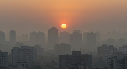 Fototapeta premium City Skyline Under Hazy Sunset with Buildings Silhouette and Orange Sky
