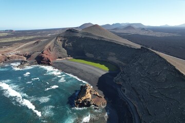 LAGUNA VERDE green lagoon near El Golfo on Lanzarote island, located in volcanic crater by the...