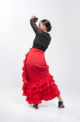 Spanish flamenco dancer in traditional dress isolated on white background for the April Fair