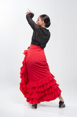 Spanish flamenco dancer in traditional dress isolated on white background for the April Fair