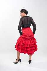 Spanish flamenco dancer in traditional dress isolated on white background for the April Fair