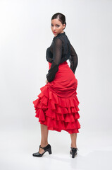 Spanish flamenco dancer in traditional dress isolated on white background for the April Fair