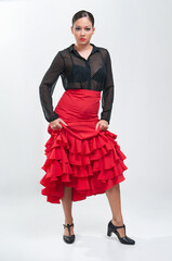 Spanish flamenco dancer in traditional dress isolated on white background for the April Fair
