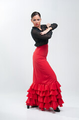 Spanish flamenco dancer in traditional dress isolated on white background for the April Fair