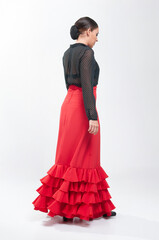 Spanish flamenco dancer in traditional dress isolated on white background for the April Fair