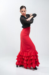 Spanish flamenco dancer in traditional dress isolated on white background for the April Fair