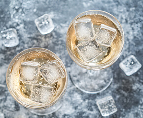 Alcohol Cocktail Prosecco On The Rocks With Sparkling Wine And Ice Cubes, Gray Background, Top View