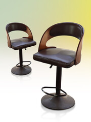 ancient and old two brown stools with backrest, old metal legs, brown color leather seat on...