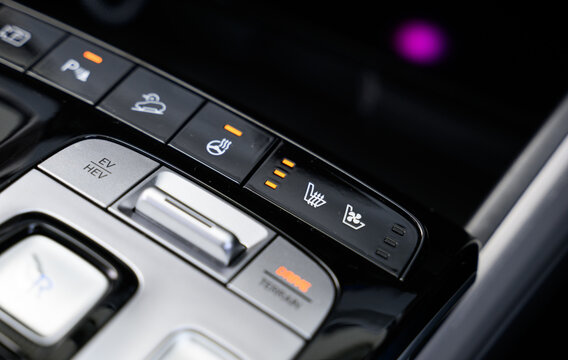 Heated seats controls with heated steering wheel and ventilated seats, the buttons for seat warmers are lit up