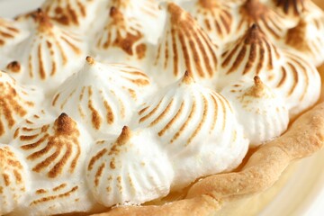 Delicious pie with browned meringue, closeup view