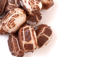 Chewy Mini Chocolate Covered Nougat Candies Isolated on a White Background