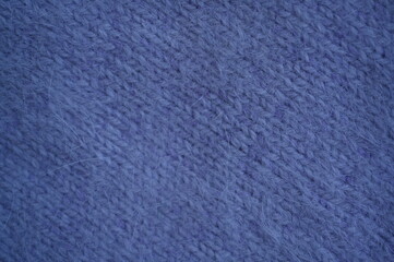 dark purple crocheted fabric as a background, texture of angora wool crochet fabric as a background 