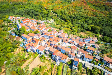 Historic town of Dobrinj in green nature aerial panoramic view, Island of Krk