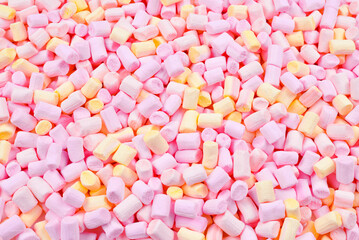 Marshmallow. Background of pink and yellow colorful mini marshmallows.