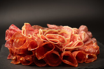 Different kinds of meat cuts on a board.