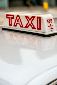 Close-up view of a taxi sign in Hong Kong