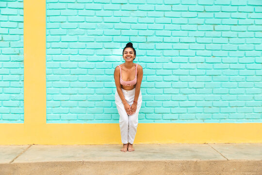 Young Latin woman enjoying vibrant coastal vibes in Mancora