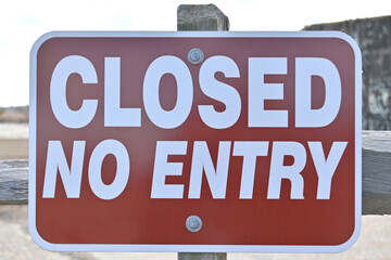 Fototapeta premium Red and white Closed No Entry restriction sign on post with background