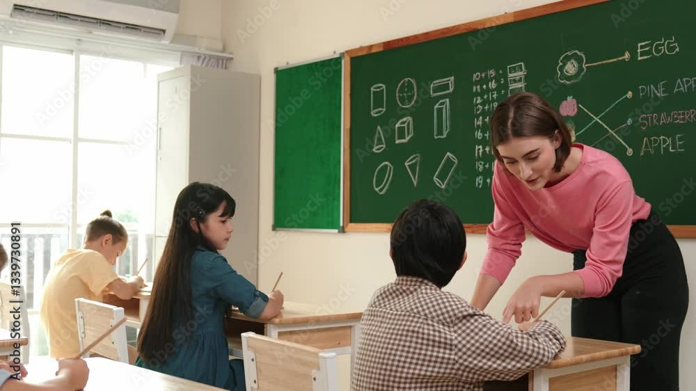 Aufkleber smart teacher checking cute student homework while explaining idea at class. attractive instructor w